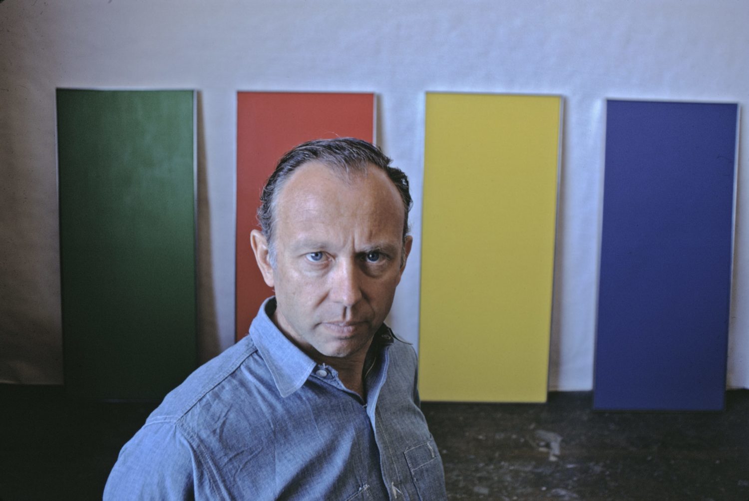 Minimalist painter Ellsworth Kelly photographed in his New York City studio in 1968, two decades after he served in the Ghost Army and had become one of the leading painters of American modernism.